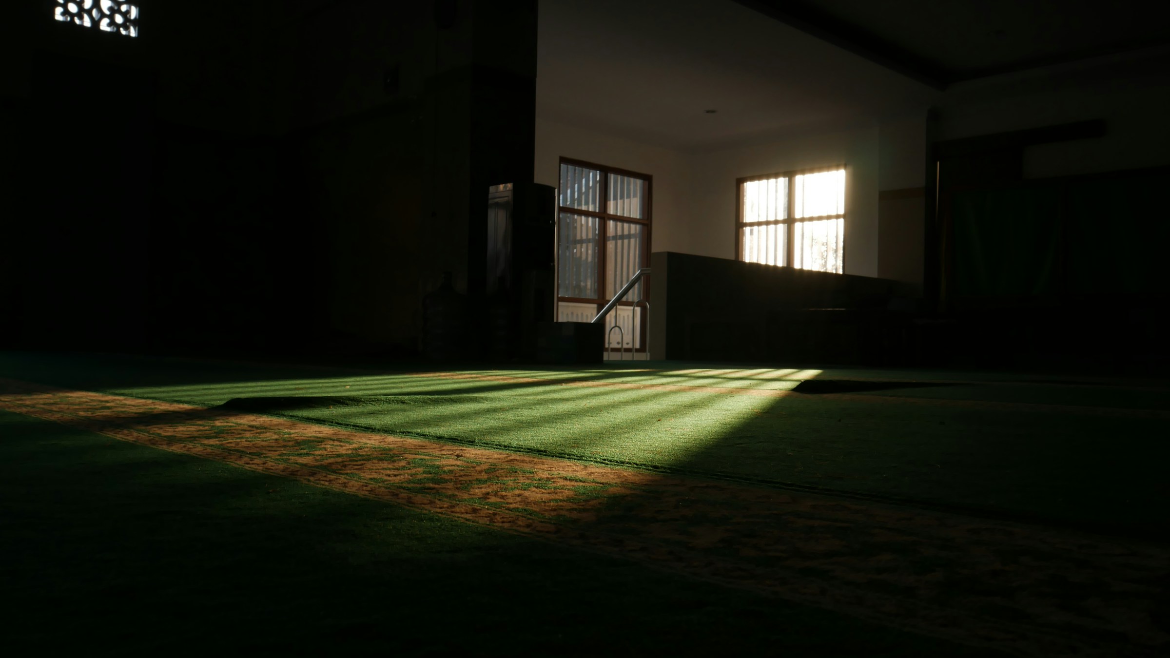 A dimly lit mosque with Resources header for the Muslims with HSV